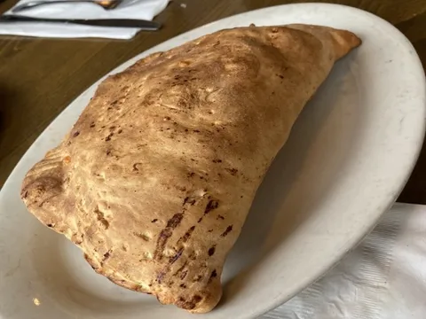 Golden baked calzone at Spiro's Pizza & Pasta in Shoreline WA